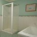Deep bath & separate shower in modern bathroom